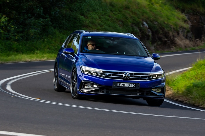 Blue 2021 Volkswagen Passat R-Line Varian on a winding road