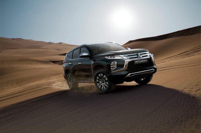 2021 Mitsubishi Pajero Sport driving through desert dunes