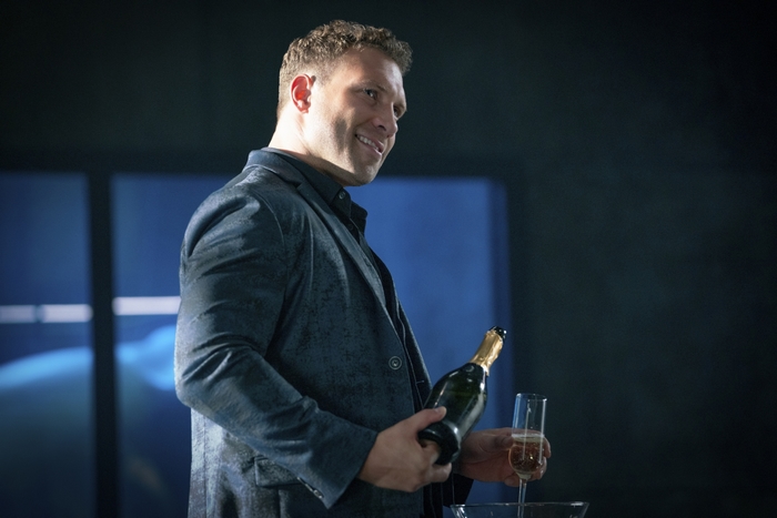 Jai Courtney Jolt HD holding champagne bottle and glass