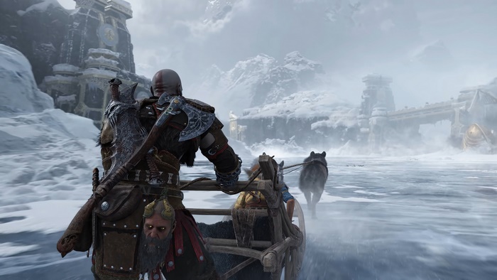 Kratos from God of War Ragnarok on a sled pulled by wolves