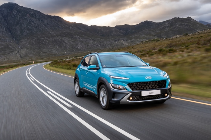 Blue 2021 Hyundai Kona SUV on a winding road