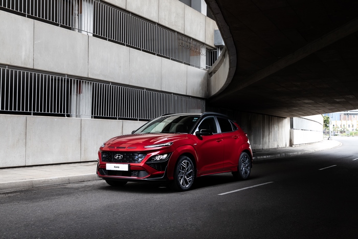 Red 2021 Hyundai Kona N Line SUV parked under bridge