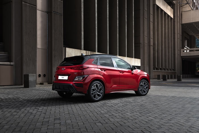 Red 2021 Hyundai Kona N Line SUV parked on brick pavement