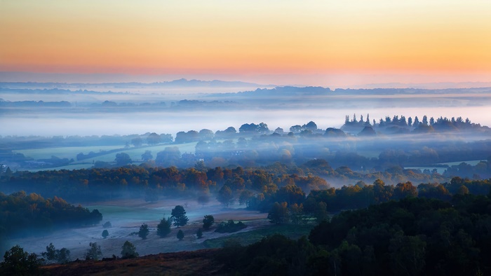 Misty valley at sunrise in the United Kingdom, 4K