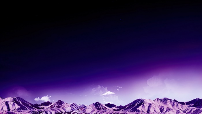 Purple mountains under a dark starry sky