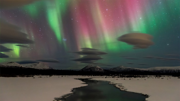 Aurora Borealis over Snowy Landscape 4K
