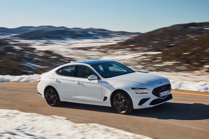 White 2021 Genesis G70 3.3T Sport on Snowy Road