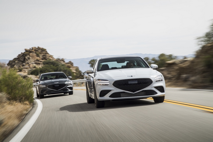White Genesis G70 3.3T AWD on a winding road