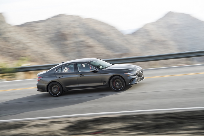 Grey 2022 Genesis G70 3.3T AWD driving on road