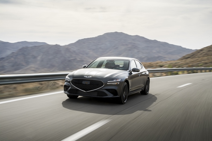Grey 2022 Genesis G70 3.3T AWD driving on road