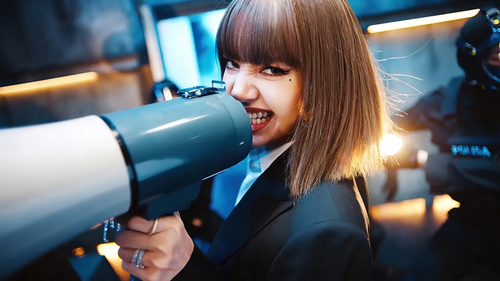 Lisa from BLACKPINK holding a megaphone