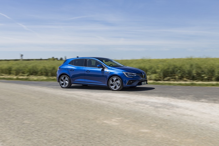Blue 2021 Renault Mégane E-TECH driving on road