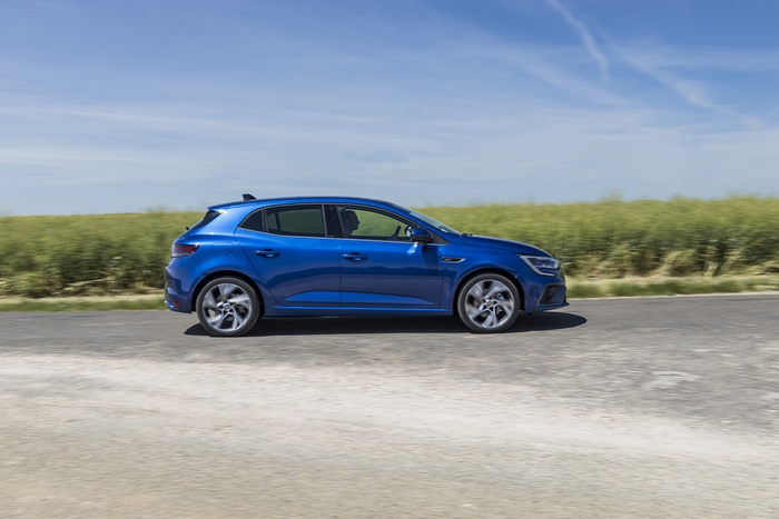 Blue 2021 Renault Mégane E-TECH driving on road