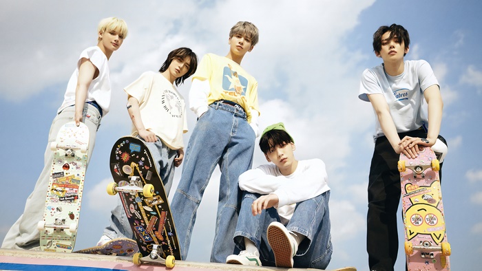 Tomorrow X Together members with skateboards