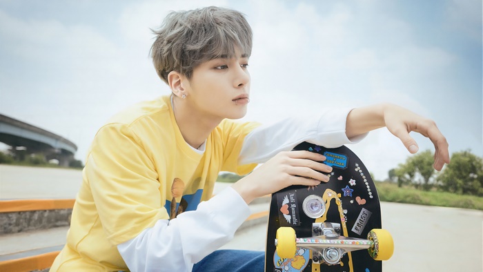 Taehyun from Tomorrow X Together with a skateboard