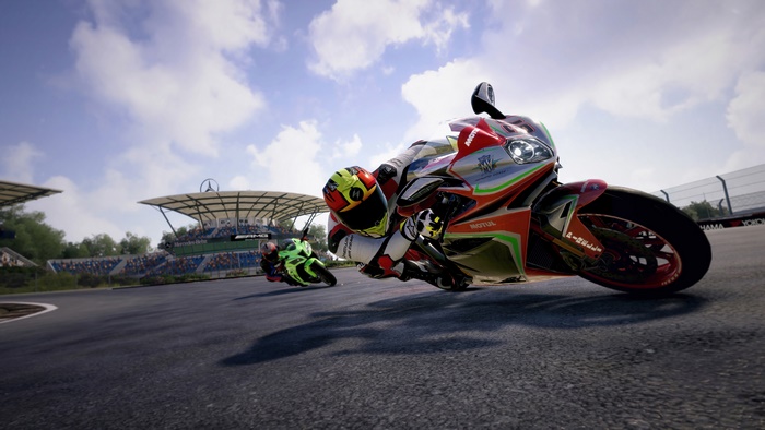 Motorcycle racing on a track with spectators