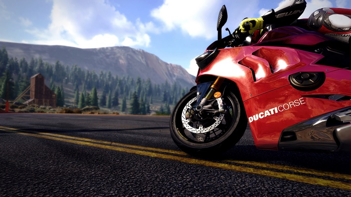 Ducati Corse motorcycle on a road with mountains