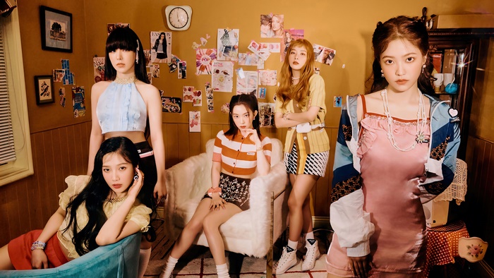 Red Velvet members in a retro-themed room