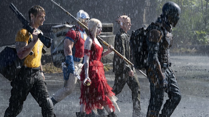 The Suicide Squad: Bloodsport, Peacemaker, Harley Quinn, Ratcatcher 2, and Polka-Dot Man in the rain