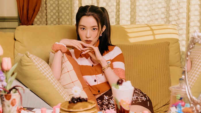 Irene from Red Velvet on a couch