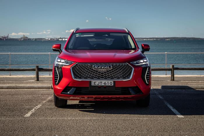 Red Haval Jolion SUV parked by the ocean