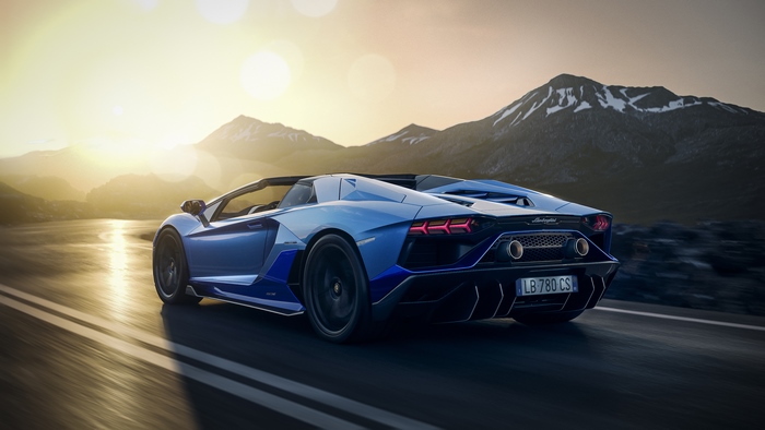 Blue Lamborghini Aventador Roadster on a mountain road