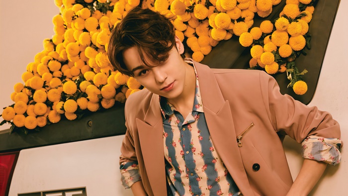 Vernon from Seventeen with yellow flowers
