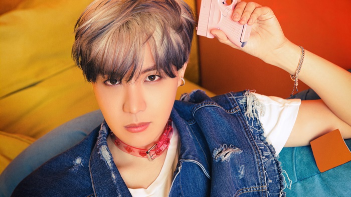 J-Hope from BTS holding a pink toy gun