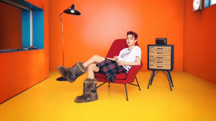 Jimin from BTS wearing a skirt and furry boots