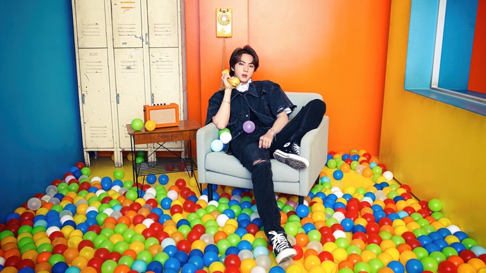 Jin from BTS in a ball pit