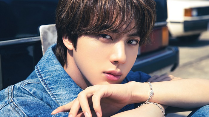 Jin from BTS wearing denim jacket