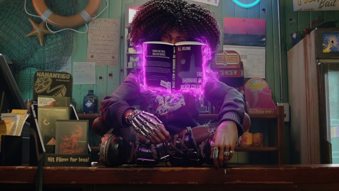 Layla Ellison from Redfall reading a book with purple energy