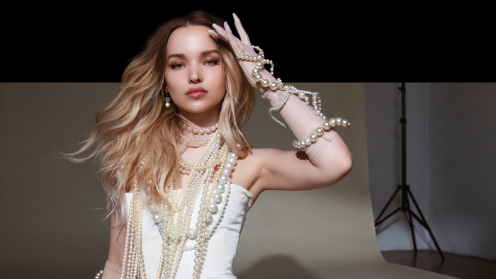 Dove Cameron wearing pearls