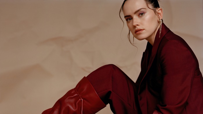 Daisy Ridley in a maroon suit