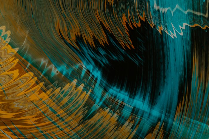Abstract blue and gold paint swirls