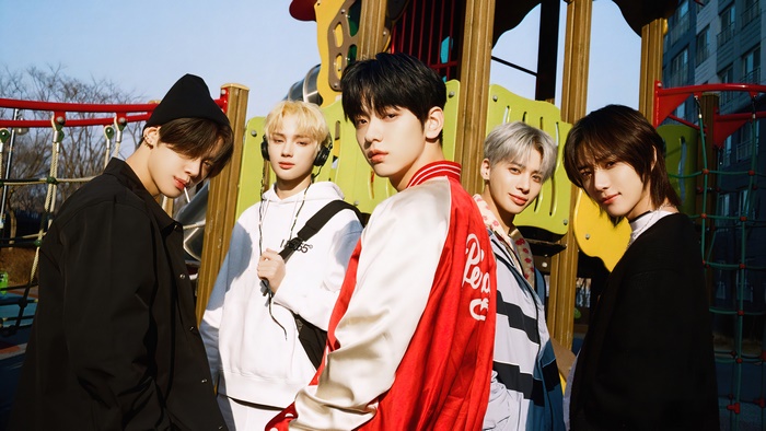 TXT members on a playground
