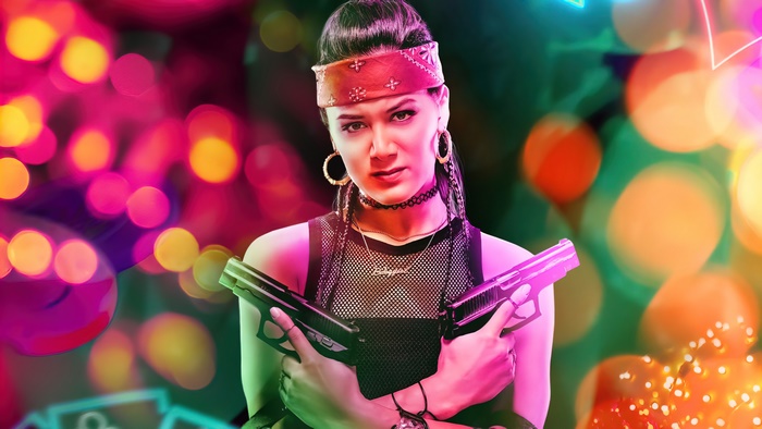 Samantha Win from Army of the Dead holding guns