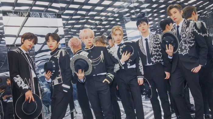 Oneus members in black suits with hats