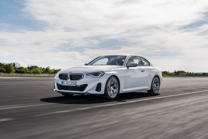 White BMW 220i Coupe driving on a road