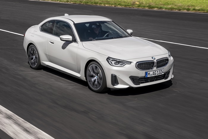 White BMW 220i Coupe driving on a track