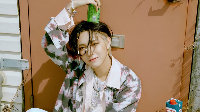 Renjun from NCT Dream with a can on his head