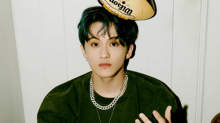 Mark from NCT Dream with a football