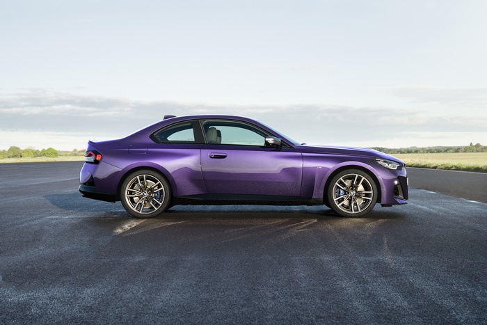 Purple BMW M240i xDrive Coupé on asphalt