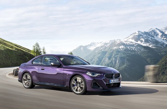 Purple BMW M240i xDrive Coupé on mountain road