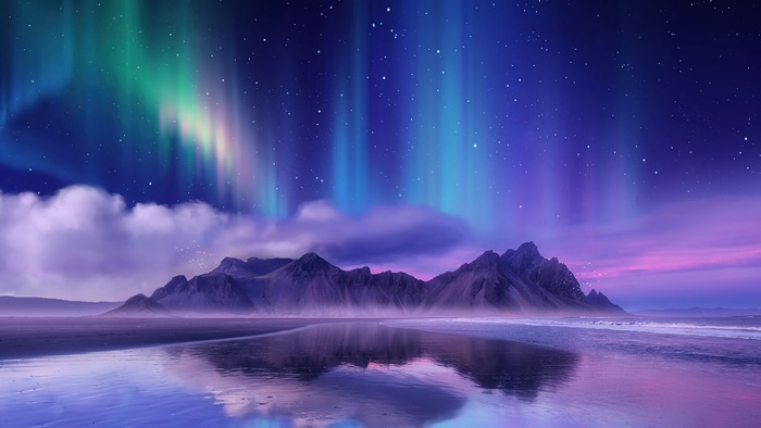 Aurora Borealis Over Mountain Landscape