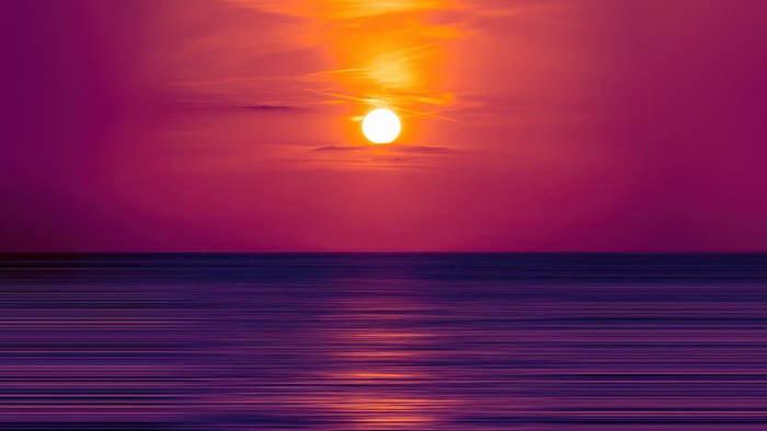 Sunset Over Horizon at Beach in