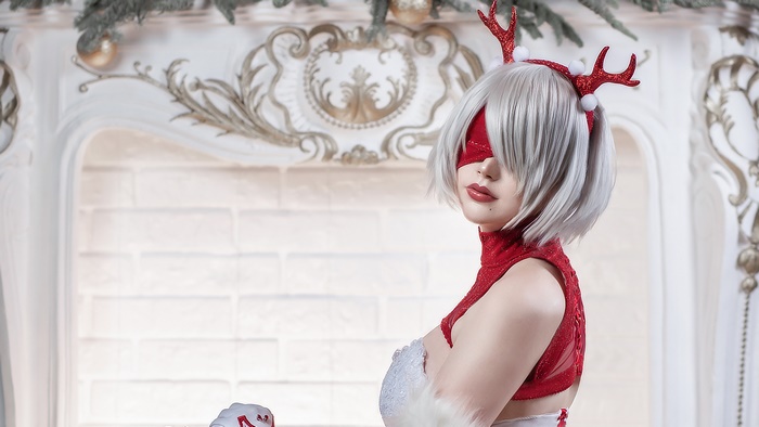 Girl in Christmas Outfit with White Hair and Reindeer Antlers