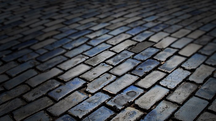 Cobblestone road texture with blue and gray bricks