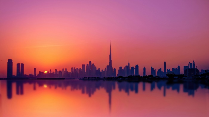 Dubai skyline silhouette at sunset 4K