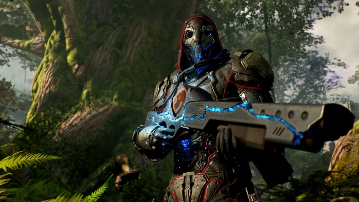 Outriders character with futuristic weapon in forest